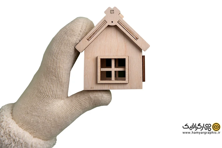 تصویر استوک ماکت چوبی خانه سه بعدی در دست | تصویر سه بعدی معماری